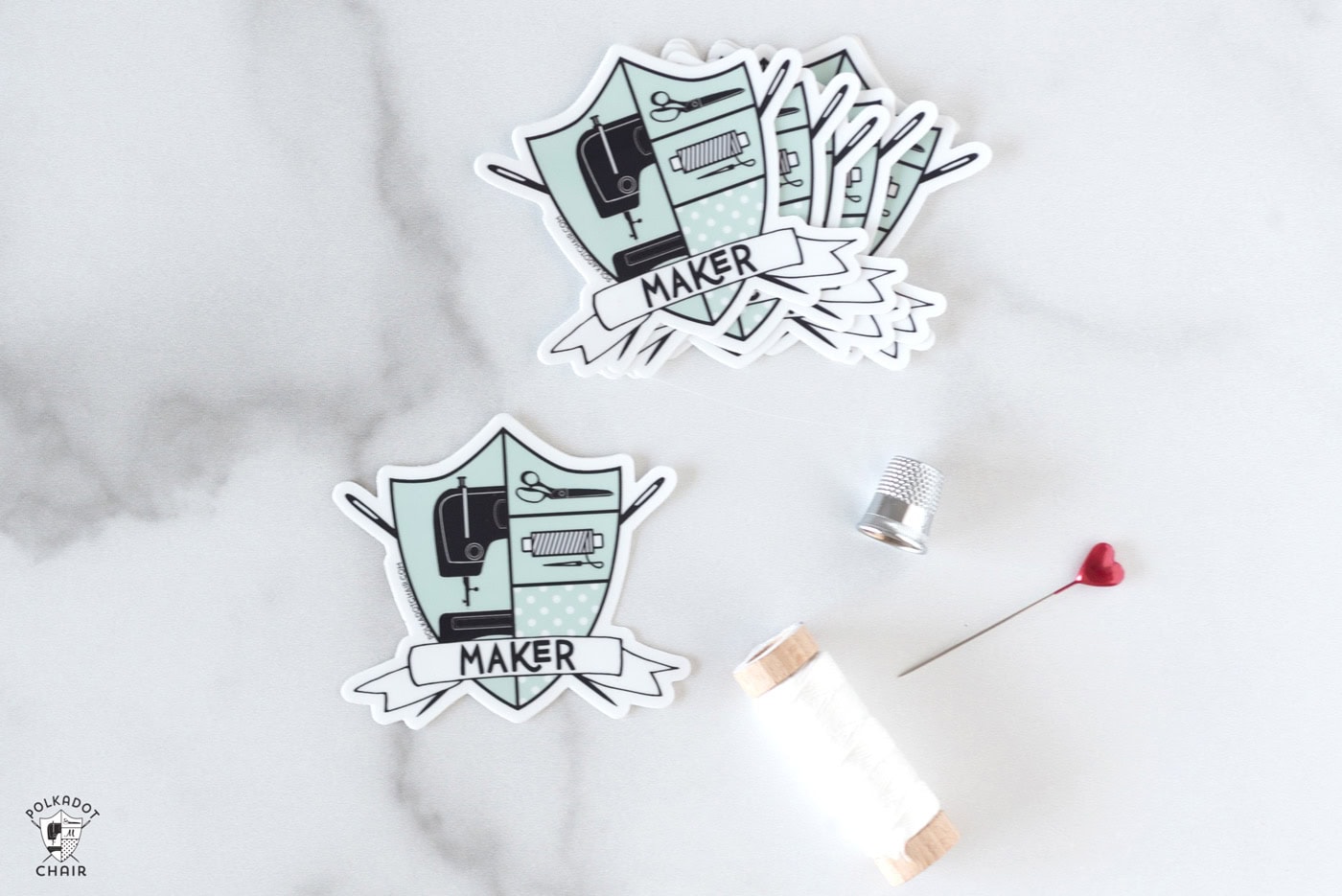 maker stickers on table with thread