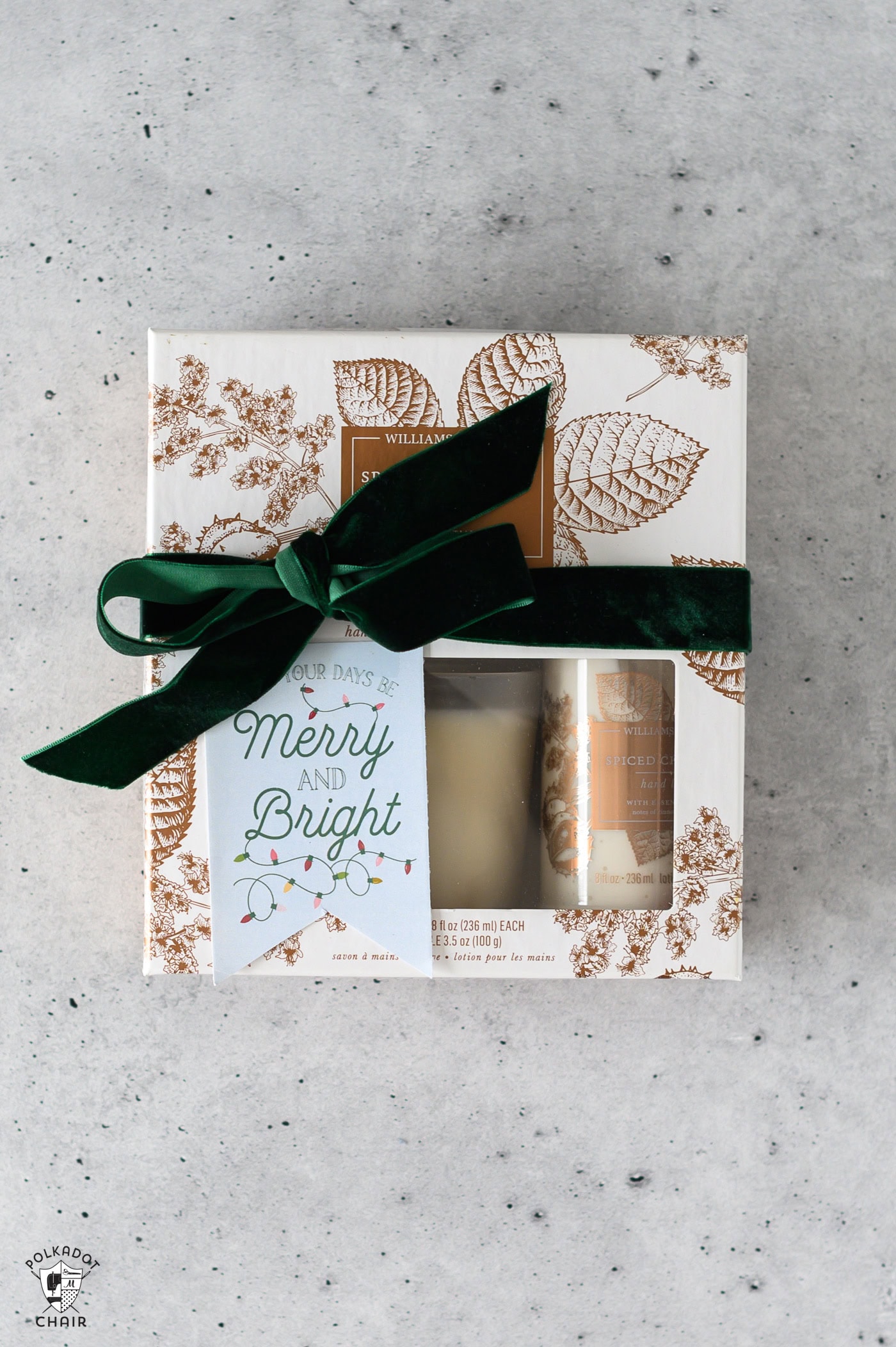candle set with bow on gray table