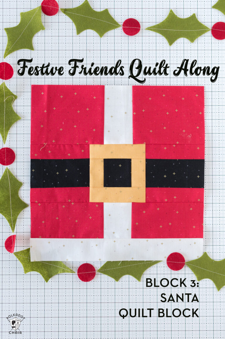 Red, black white and gold santa claus quilt block on white table