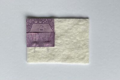 purple fabrics with quilt batting on white table
