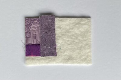 purple fabrics with quilt batting on white table