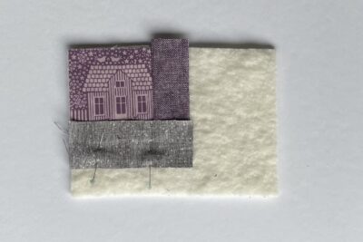purple fabrics with quilt batting on white table