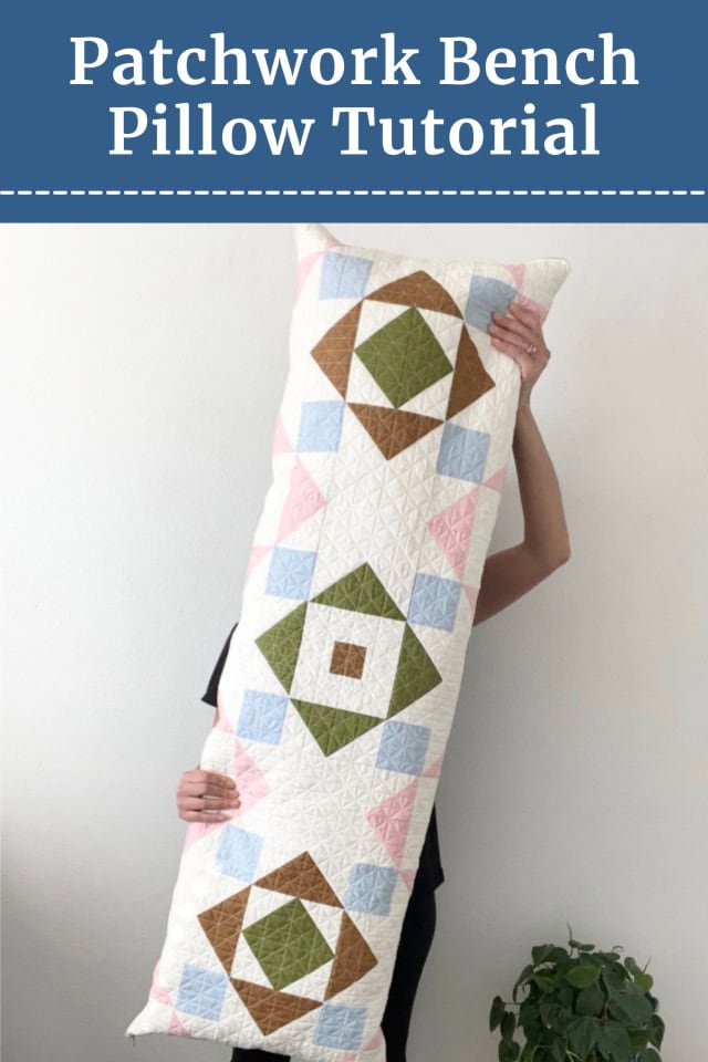 woman holding large patchwork pillow