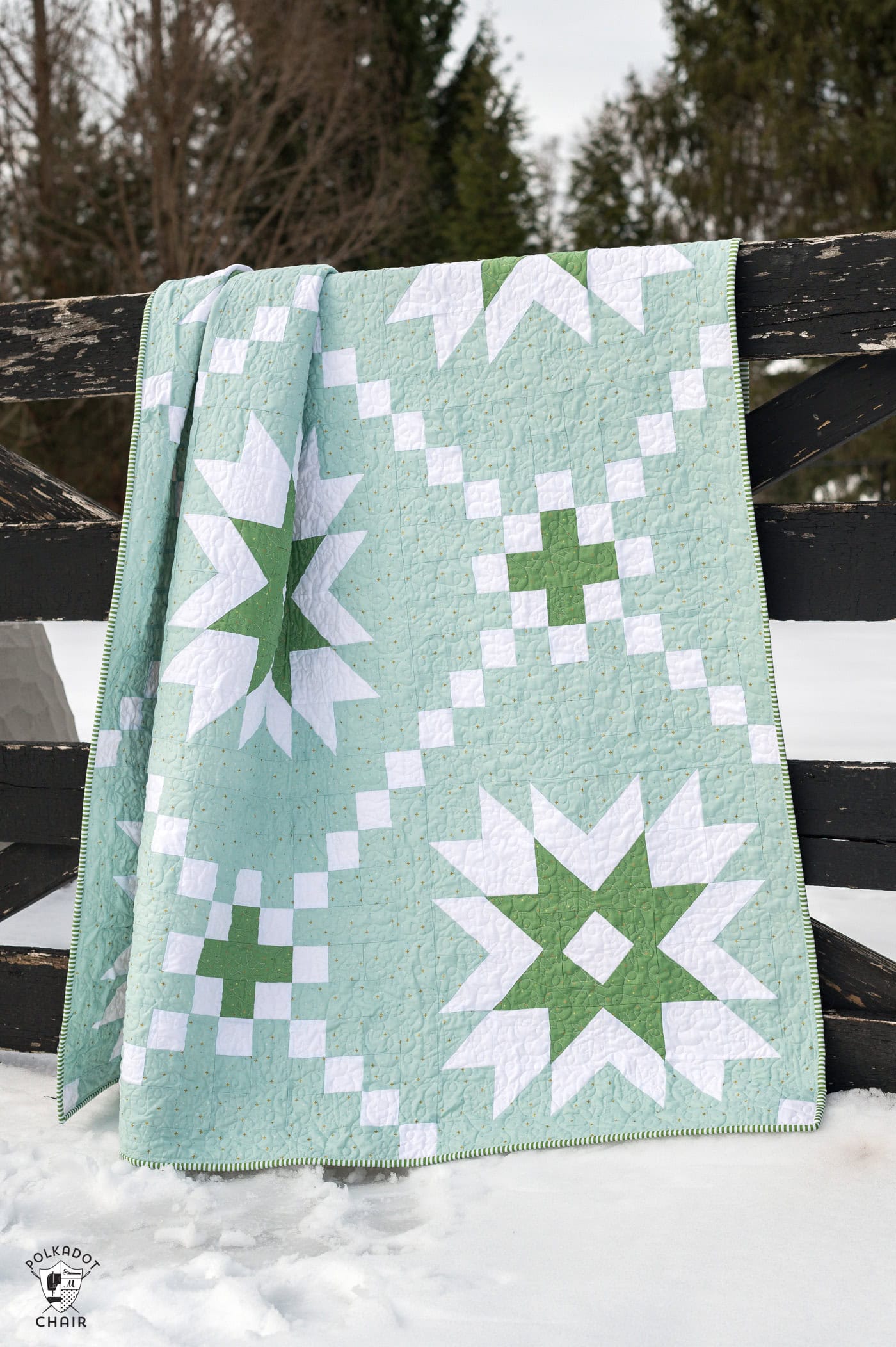 mint and green quilt outdoors in snow
