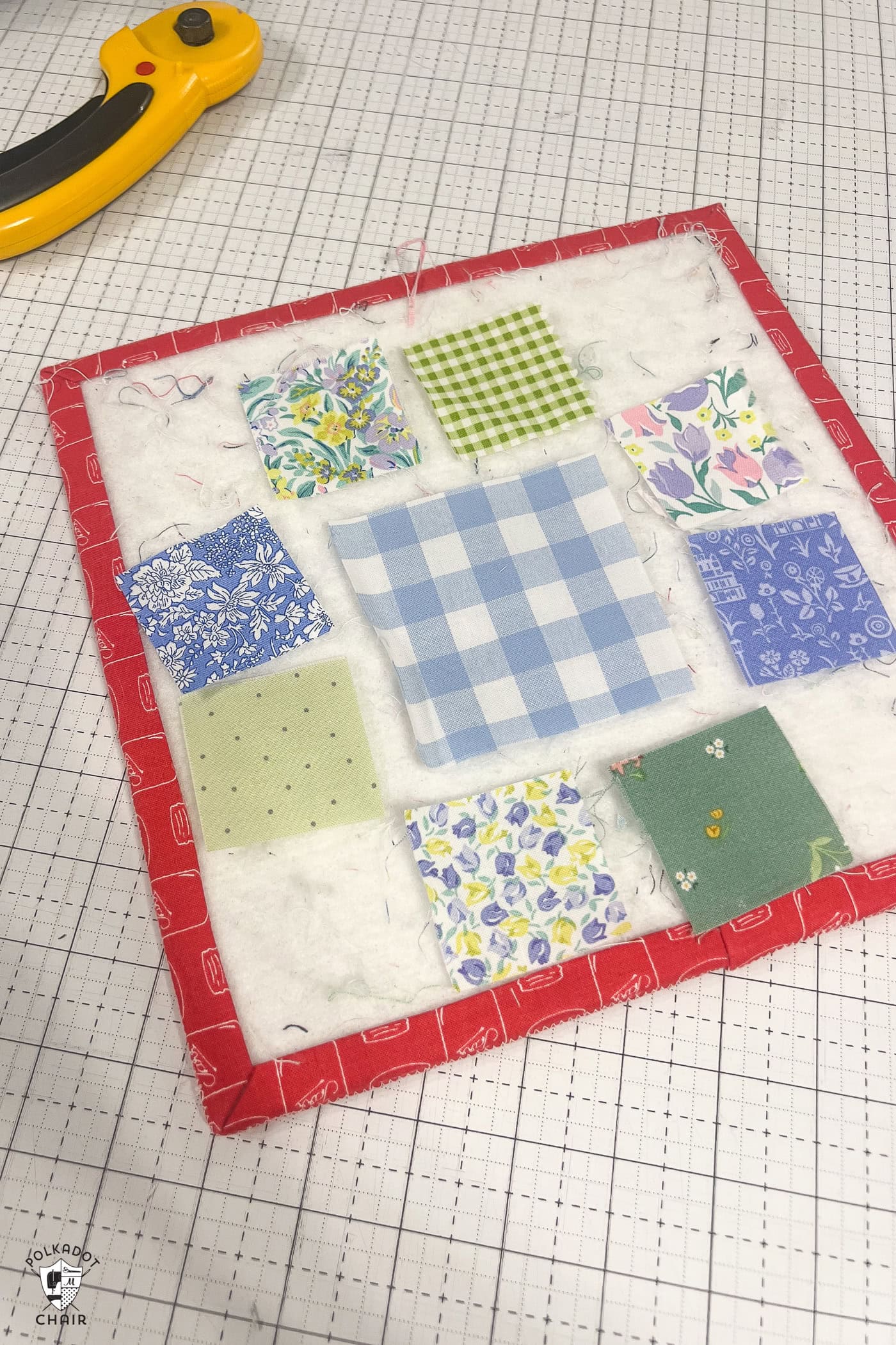fabric squares laid out on board