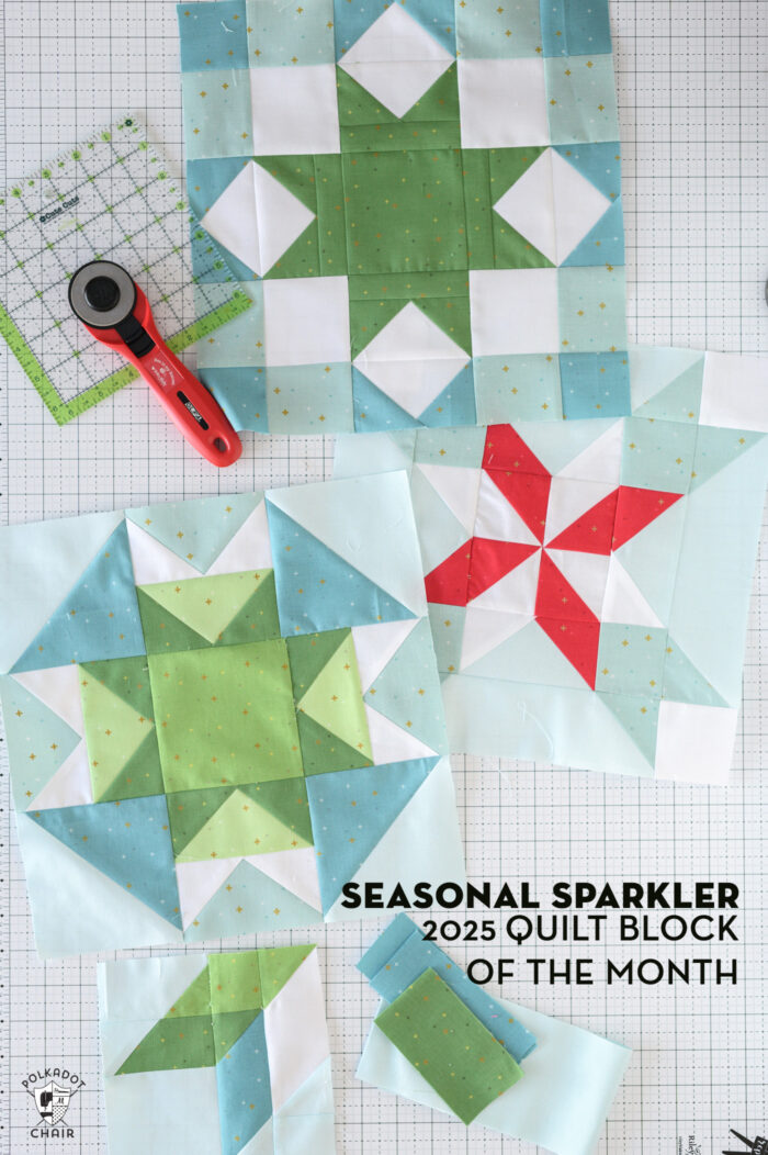 Blue and green quilt blocks on white cutting mat with quilt ruler and rotary cutter