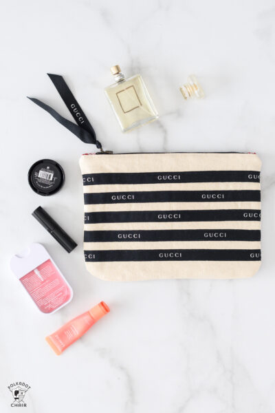 black and white striped bag on marble table