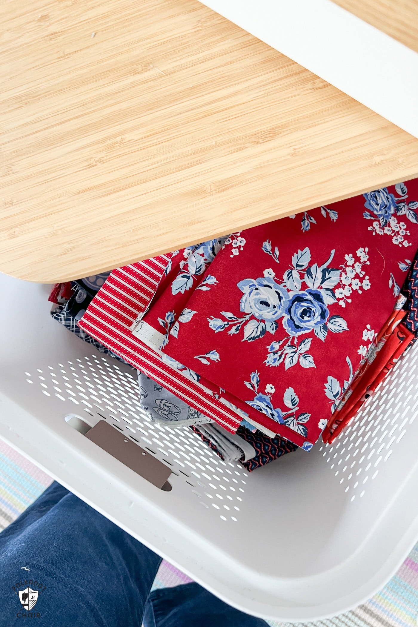 red fabric in plastic bin
