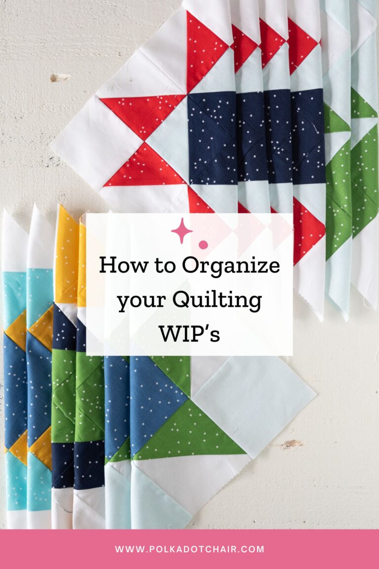 stack of colorful quilt blocks on white wood table