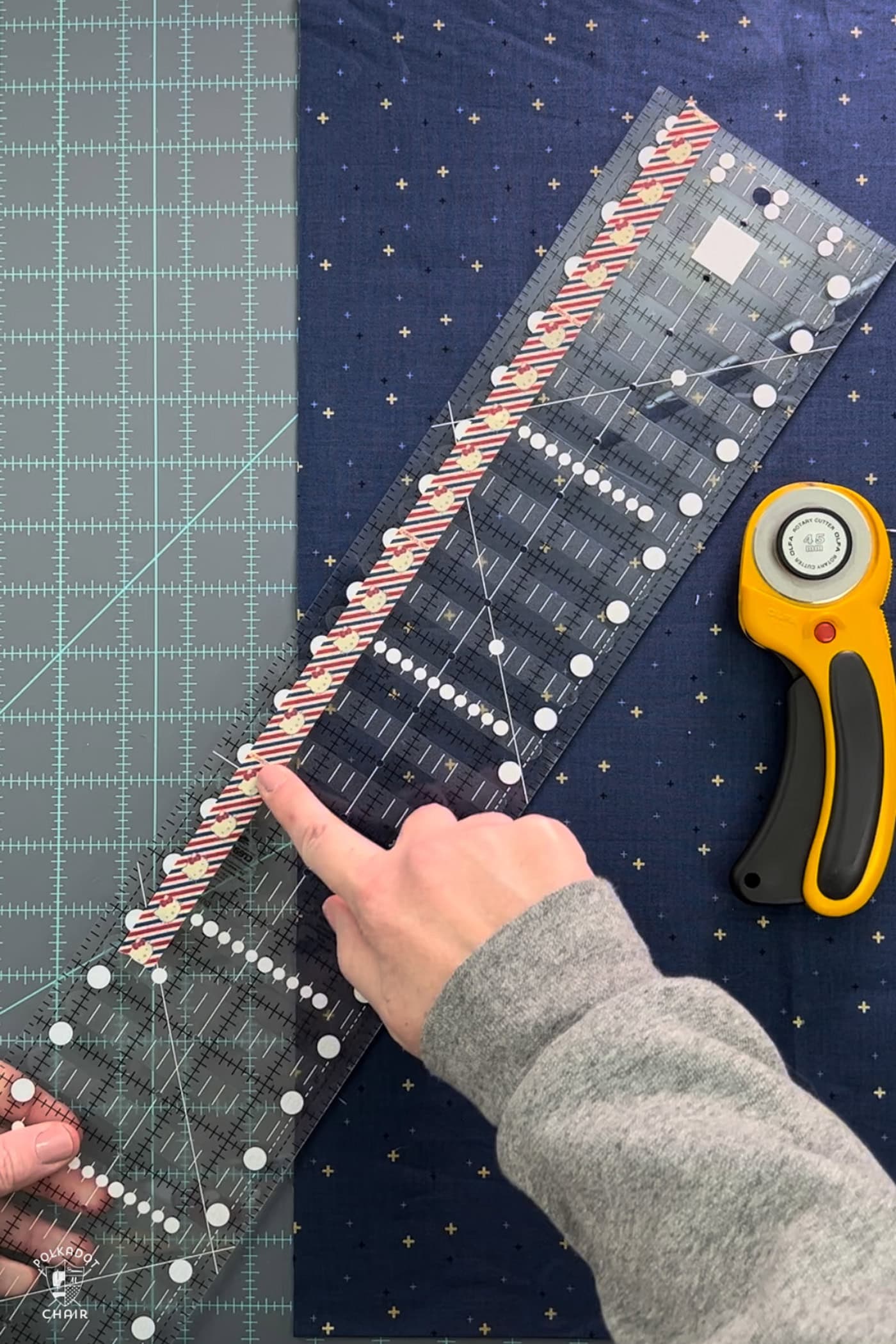 quilt ruler and blue fabric on cutting mat
