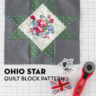 gray, green and white ohio star quilt block on white table