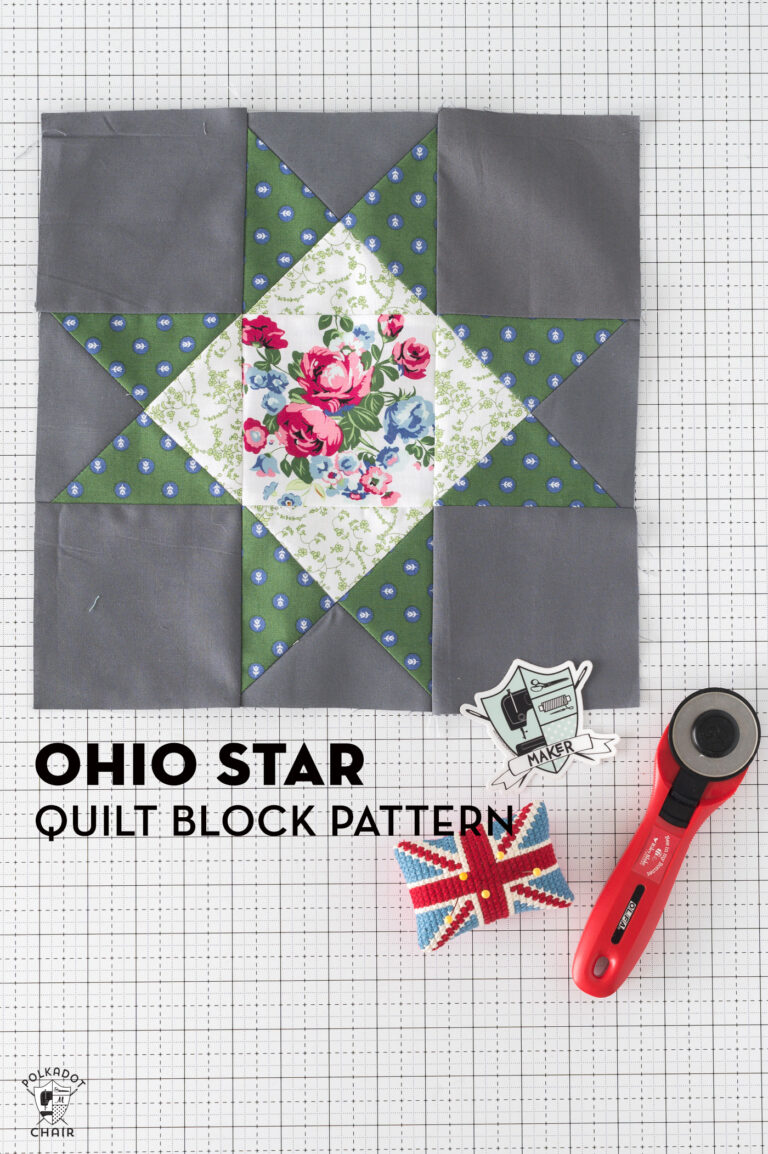 gray, green and white ohio star quilt block on white table