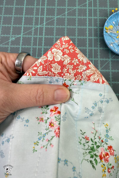 construction process of zip bag featuring blue floral fabric and coral floral fabric