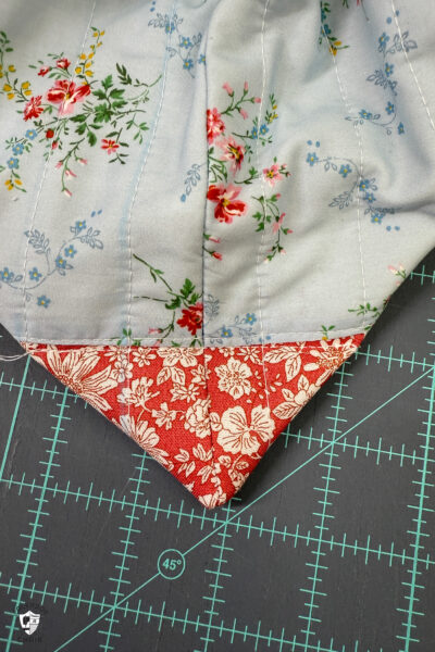 construction process of zip bag featuring blue floral fabric and coral floral fabric