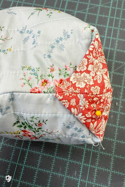 construction process of zip bag featuring blue floral fabric and coral floral fabric