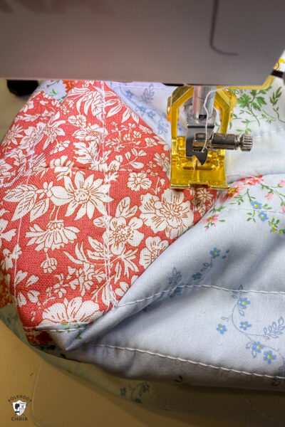 construction process of zip bag featuring blue floral fabric and coral floral fabric