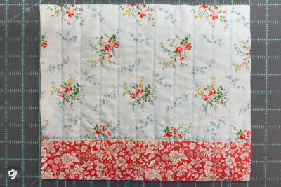 construction process of zip bag featuring blue floral fabric and coral floral fabric