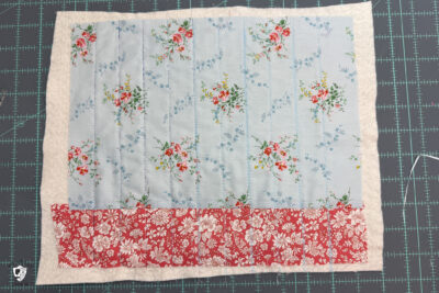 construction process of zip bag featuring blue floral fabric and coral floral fabric
