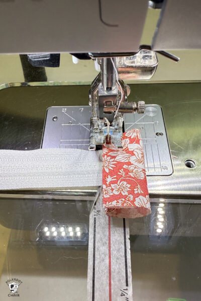 construction process of zip bag featuring blue floral fabric and coral floral fabric
