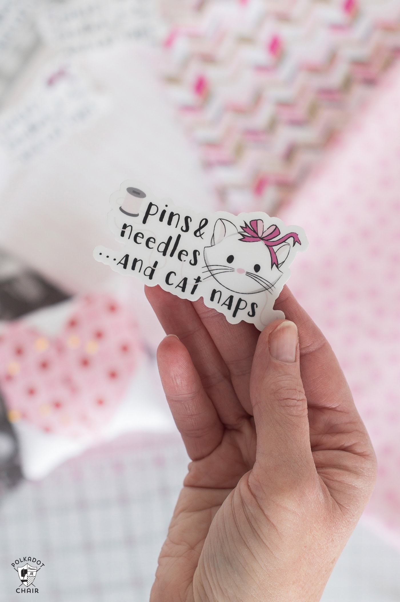 hand holding cat sticker