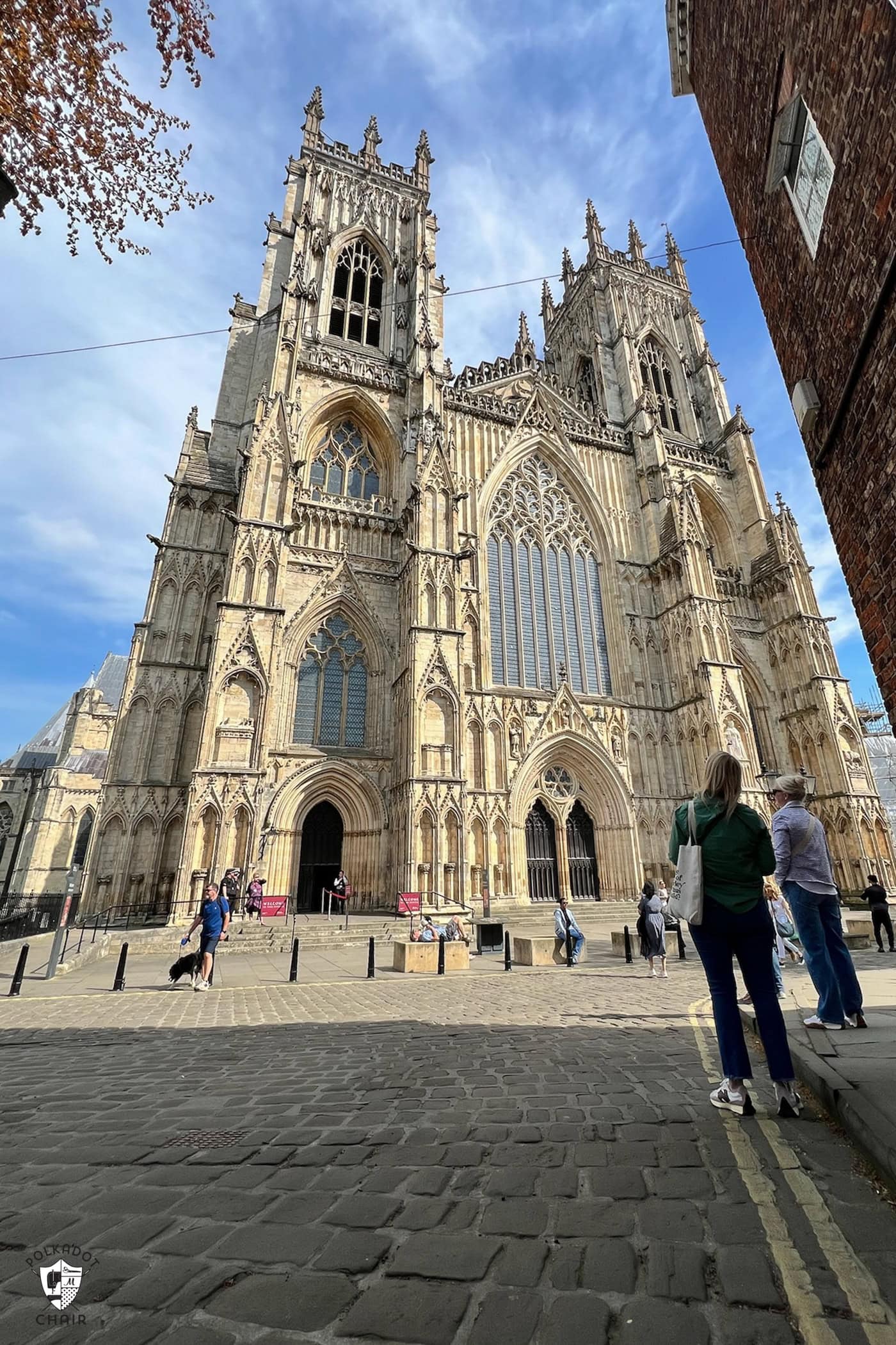 woman standing in view of cathedral, York