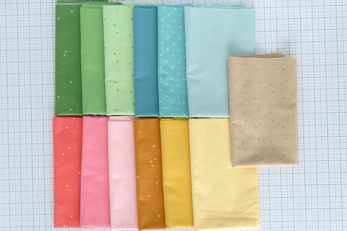 colorful fabrics on cutting mat