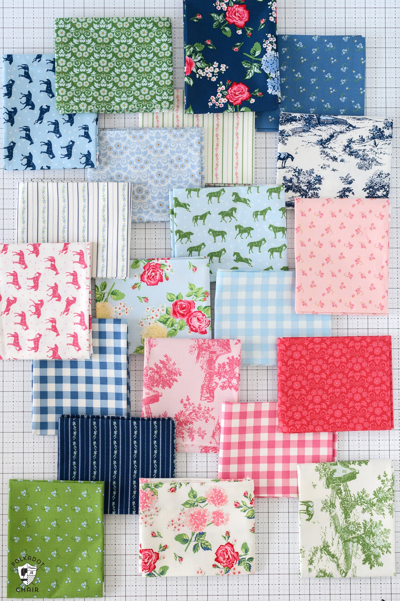 selection of fabric swatches on white table with various props