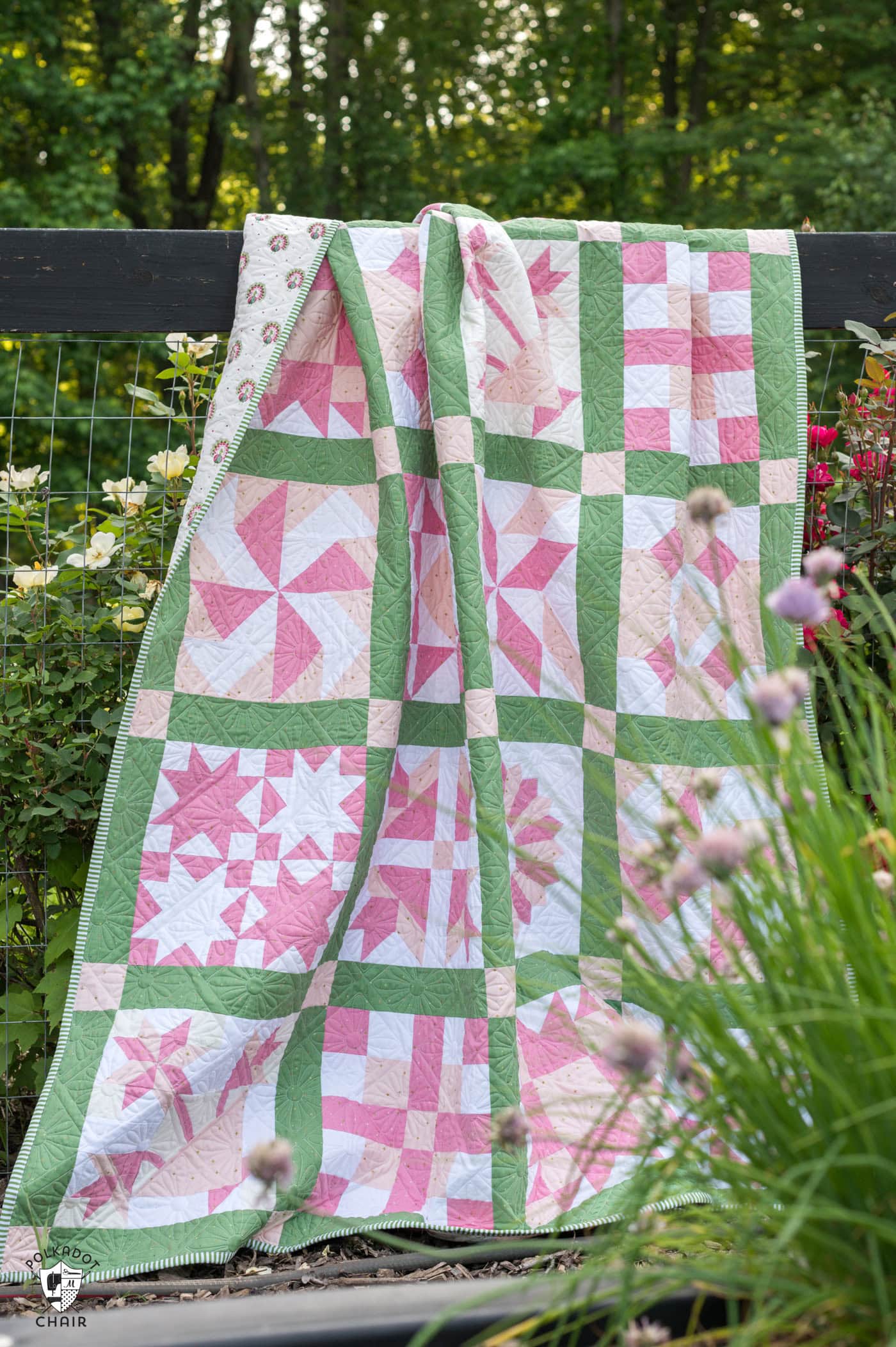 pink and green sampler quilt outdoors