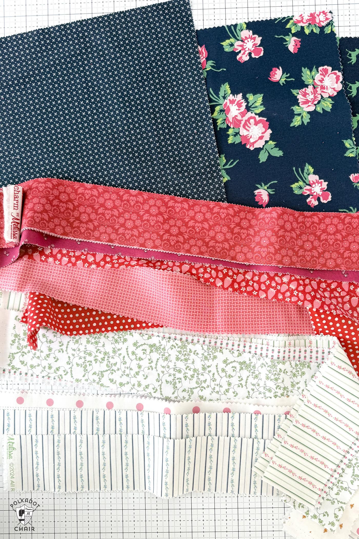 stack of red white and blue fabrics on cutting mat
