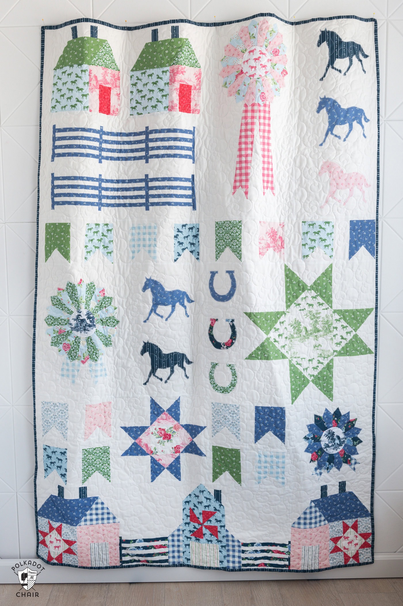 country inspired traditional sampler quilt hanging on wall