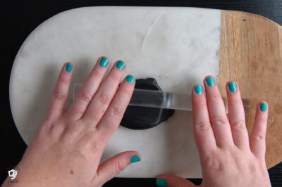 Clay being rolled out on cutting mat