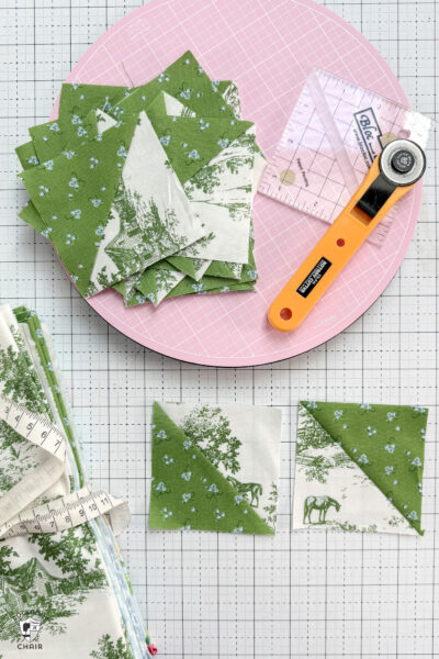 green and white half square triangles on white cutting mat