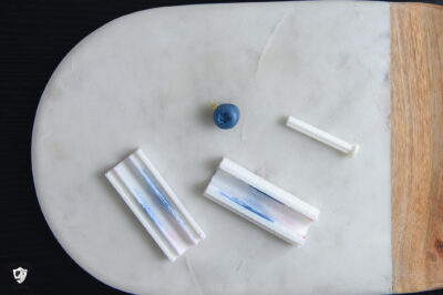 Clay blueberry on cutting mat