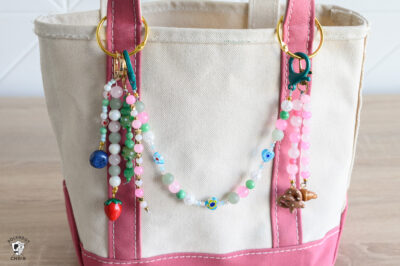 bag charms on pink canvas tote bag