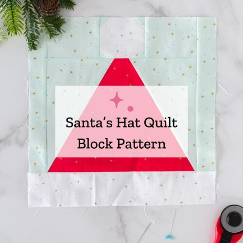 Santa hat quilt block on white table