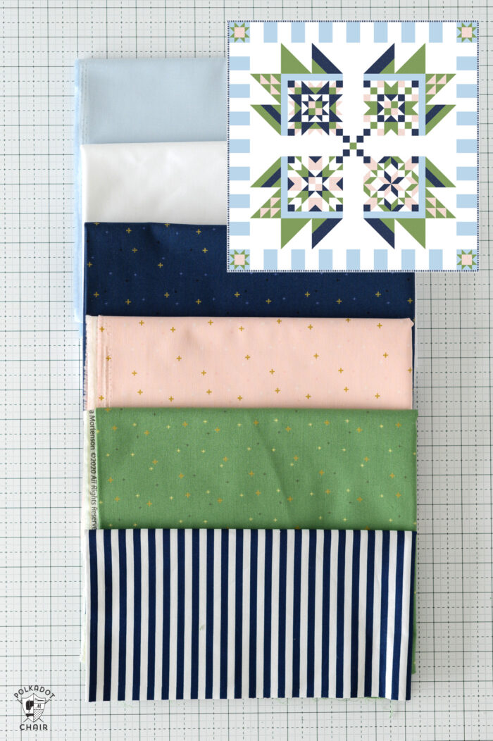 Blue, white, navy, pink and green fabrics with quilt overlay image