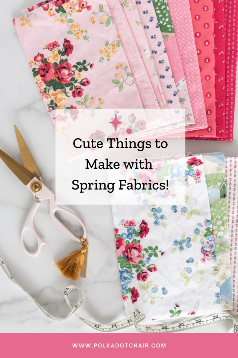 stack of pink and white floral spring fabrics on white table top with scissors and tape measure