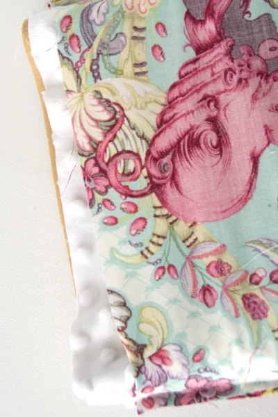 Padded lining being added to fabric bag