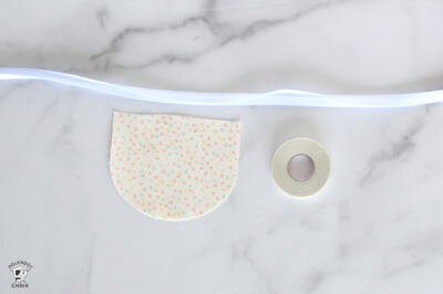 Decorative polka dot washi tape on marble surface with LED strip lighting.