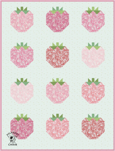 Colorful strawberry quilt blocks with floral patterns for quilting projects.