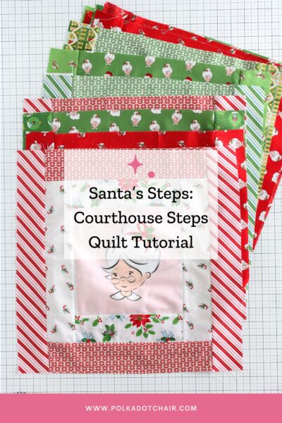 stack of colorful red, green and pink courthouse steps quilt blocks on a white cutting mat