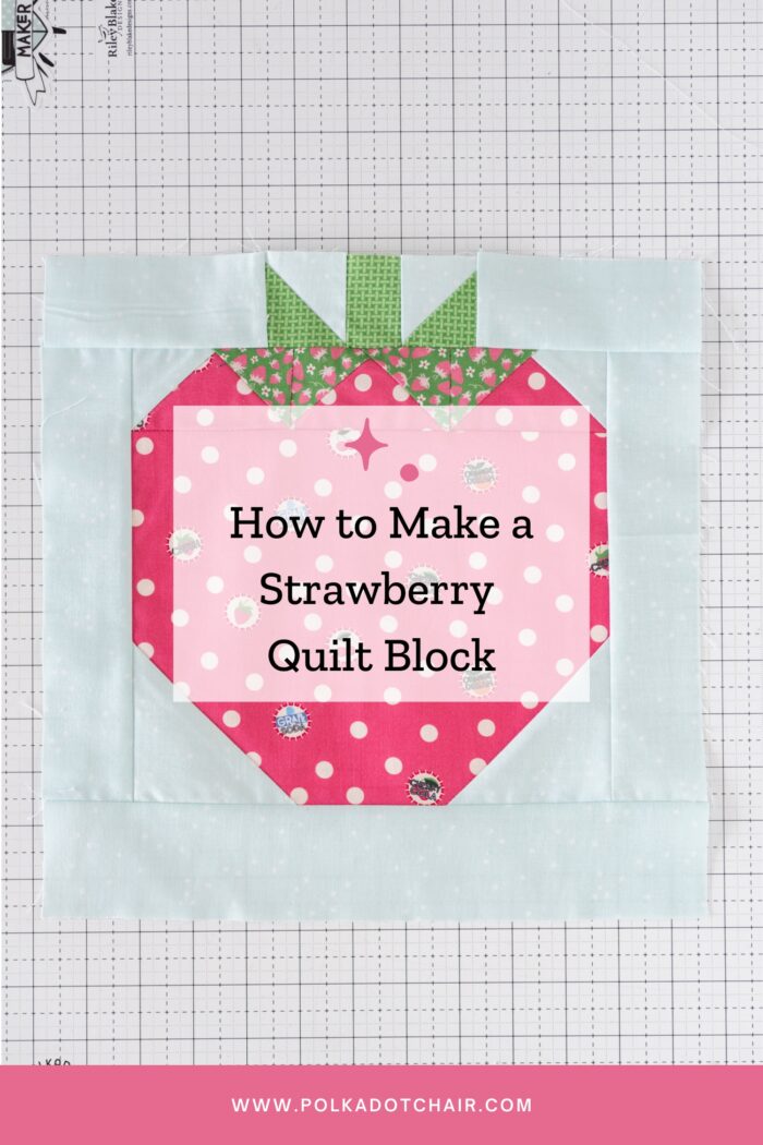 sewn strawberry quilt block on white cutting mat with text overlay