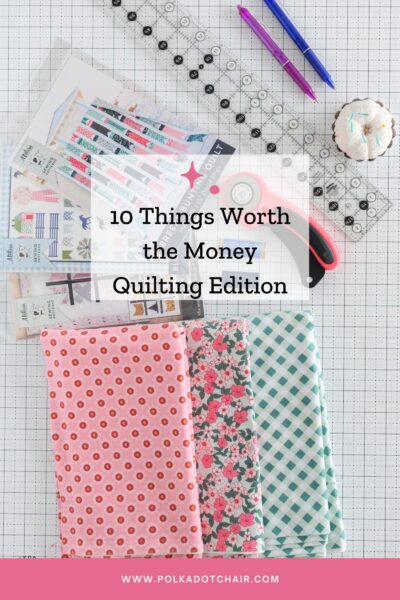 sewing notions on white cutting mat with fabric