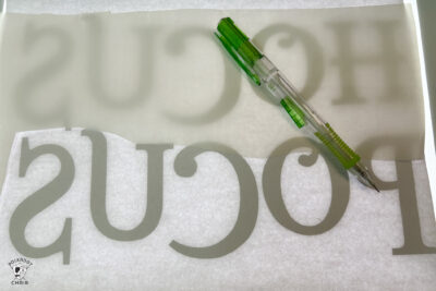 close up of paper and paper backed fusible web on light box