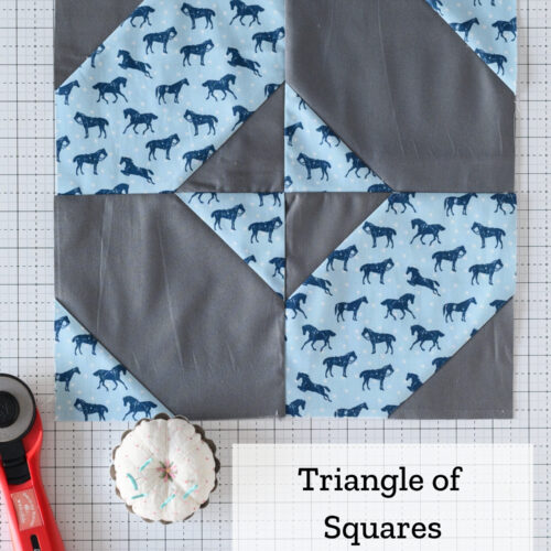 gray and blue quilt block on white cutting mat with text overlay